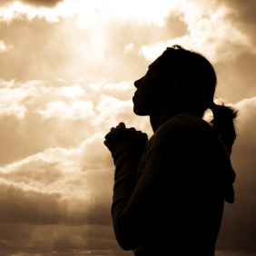 Woman praying silhoutte